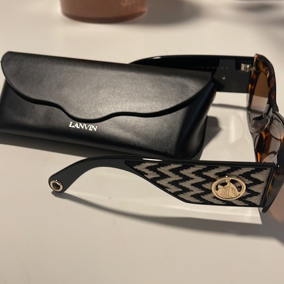 Brand new Lanvin sunglasses for women. Black and white wings with brown frame.